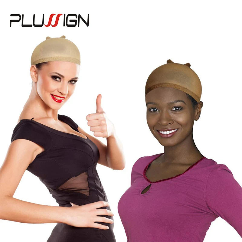 A woman models a beige stretchable nylon wig cap on her head, posing with a thumbs-up gesture.