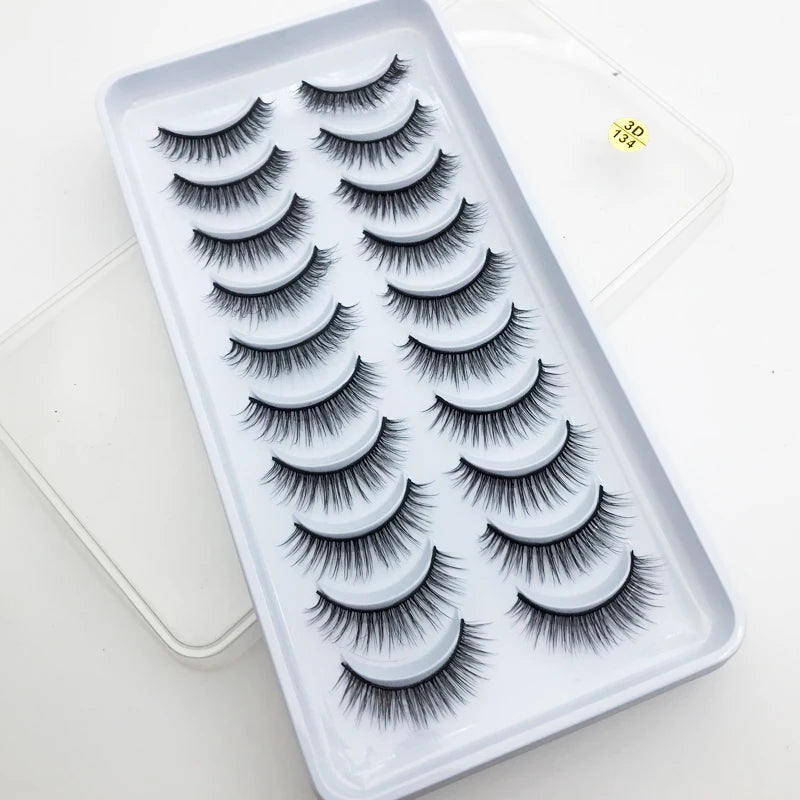 A tray of dramatic mink false eyelashes is displayed on a white background.