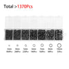A collection of black jewelry findings including various sizes of rings and jump rings packaged in clear compartments.