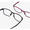 A pair of purple-framed eyeglasses with black silicone nose pads shown from the side.