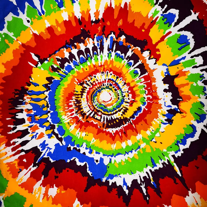 Patrón abstracto vibrante y arremolinado de rojo, naranja, amarillo, verde y azul en una tela.