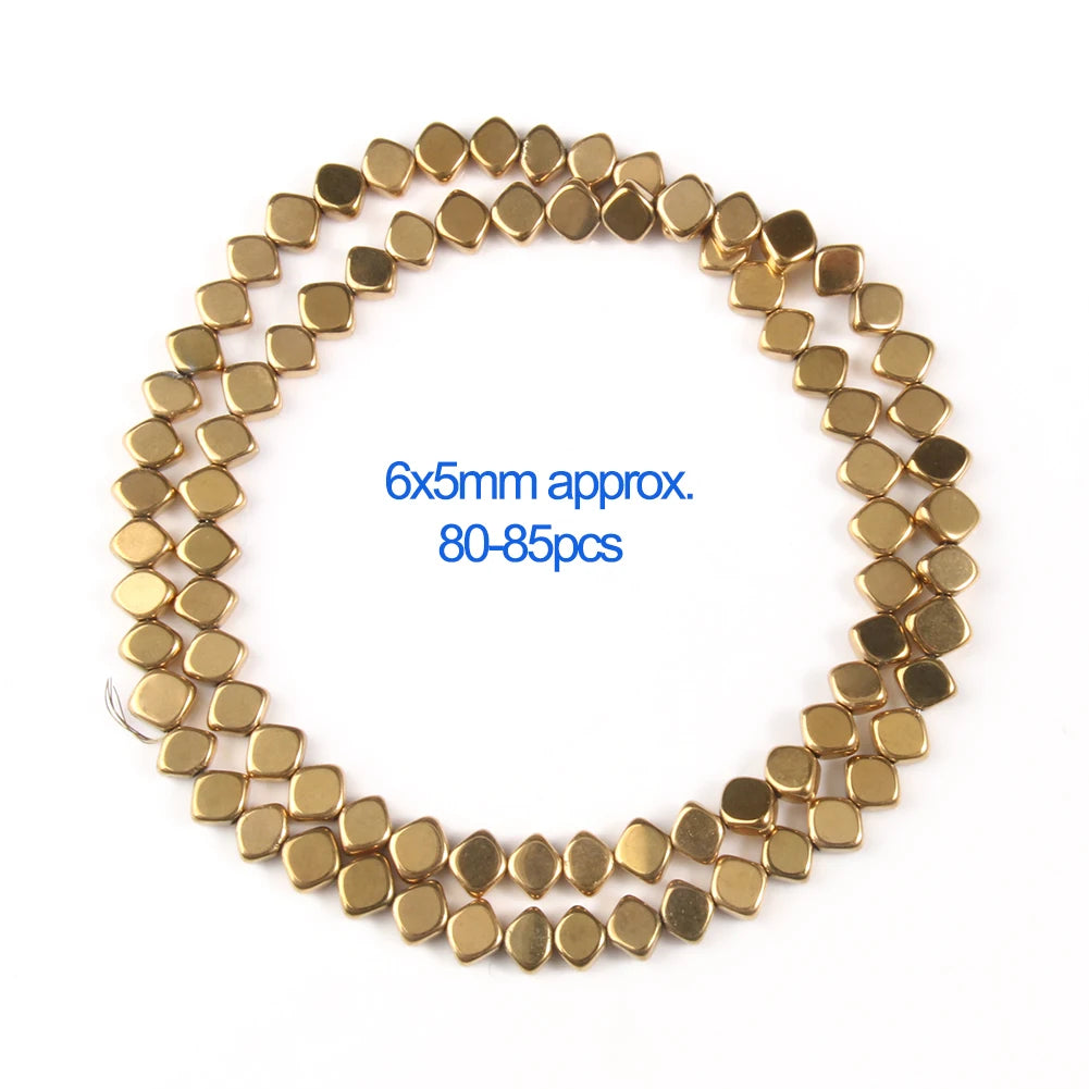 A circular arrangement of gold-plated hematite round cube beads, approximately 80-85 pieces.