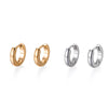 A set of minimalist hoop earrings in gold and silver finishes.