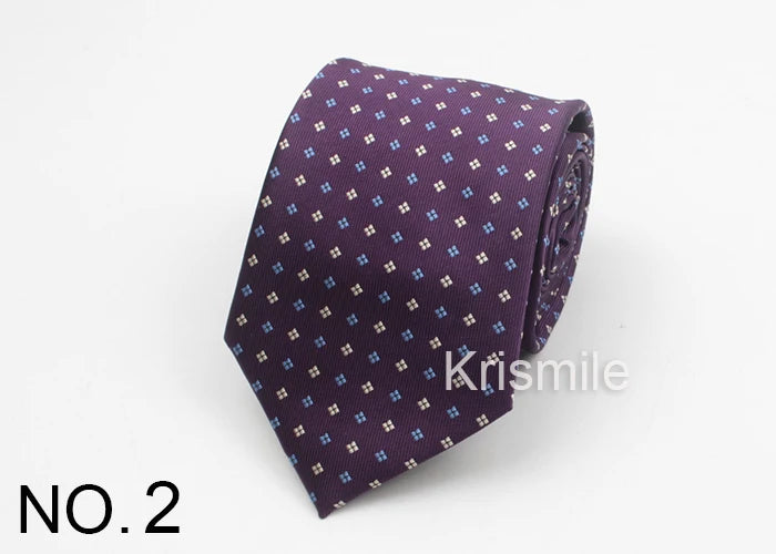 A purple necktie with a small blue dot pattern folded and displayed on a white background.
