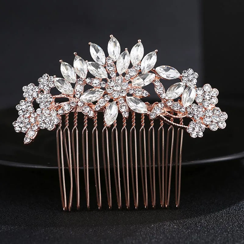 A bridal hair comb tiara featuring delicate silver rhinestones and leaves, designed for hair decoration.