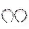 Two black elastic hair hoops, one measuring 2cm and the other 1.3cm.