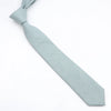 A light blue men's solid color anti-wrinkle bamboo fiber tie shown flat.