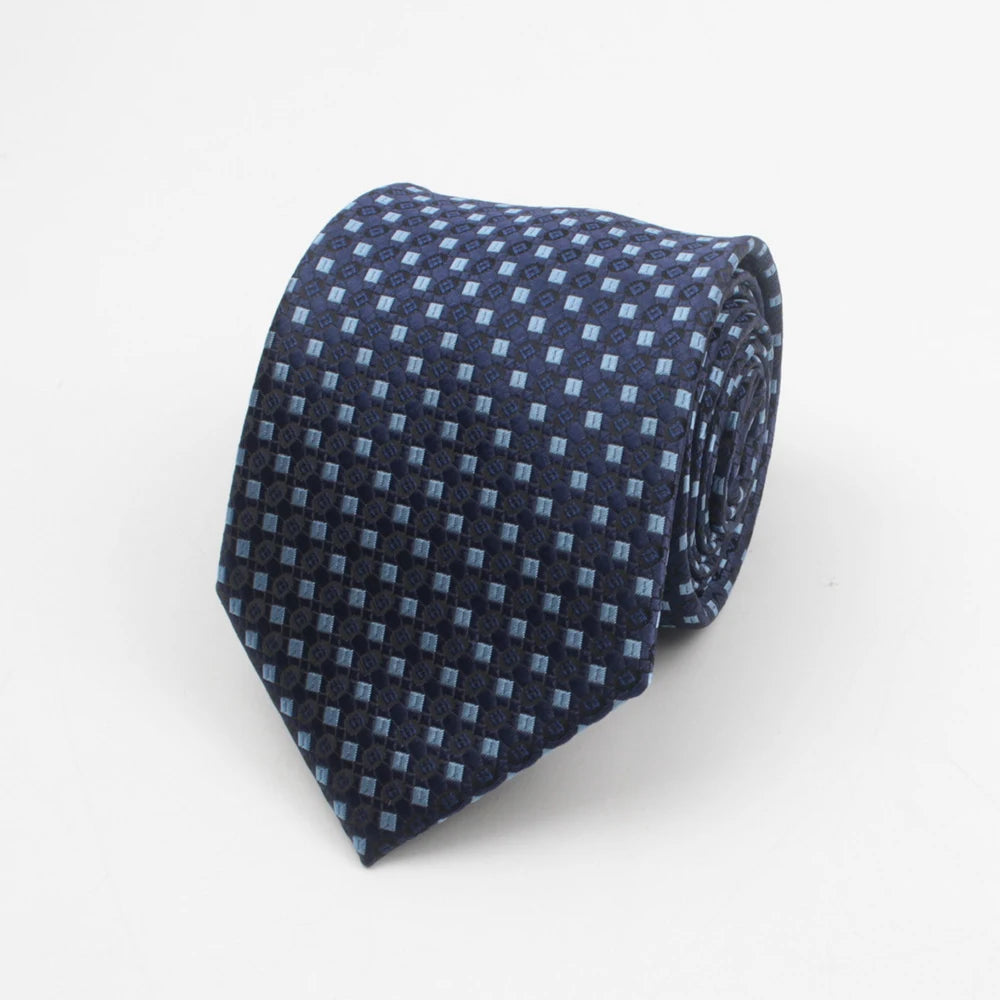 A dark blue necktie with a repeating pattern of small dots and stripes.