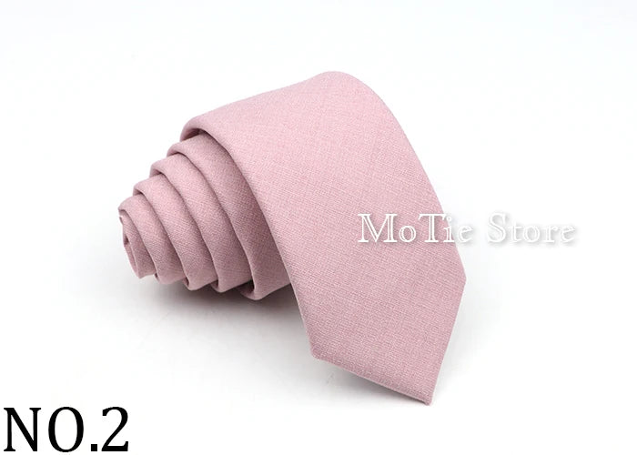 A rolled pink tie, No. 2, made of anti-wrinkle bamboo fiber.