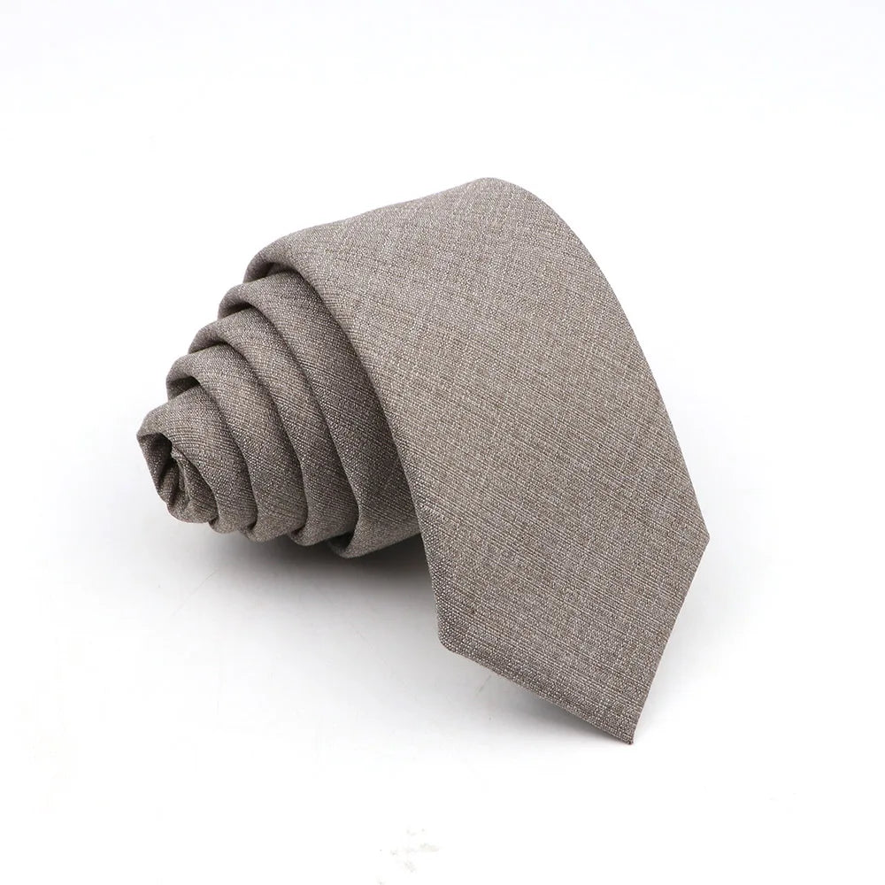 A folded gray men's solid color anti-wrinkle bamboo fiber tie.