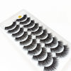 A close-up of dramatic mink false eyelashes displayed on a white surface.
