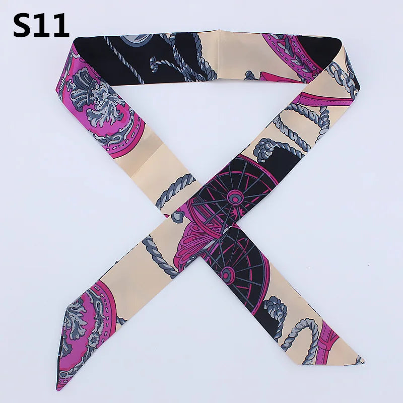A silk headband scarf featuring a multi-color leopard print design with intricate patterns.