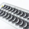 A tray of dramatic mink false eyelashes displayed on a white background.