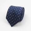 Navy blue necktie with a pattern of small yellow and light blue squares and dots.
