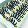 A tray of black handmade 3D mink false eyelashes with gold accents.