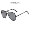 Black metal aviator sunglasses with a gradient lens and black frame shown against a white background.