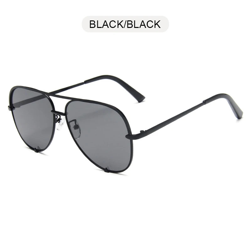 Black metal aviator sunglasses with a gradient lens and black frame shown against a white background.
