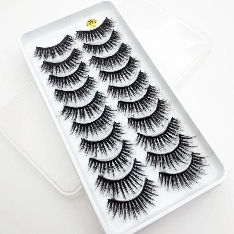 A tray of dramatic mink false eyelashes displayed on a white background.