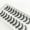 A display of dramatic mink false eyelashes on a white tray.