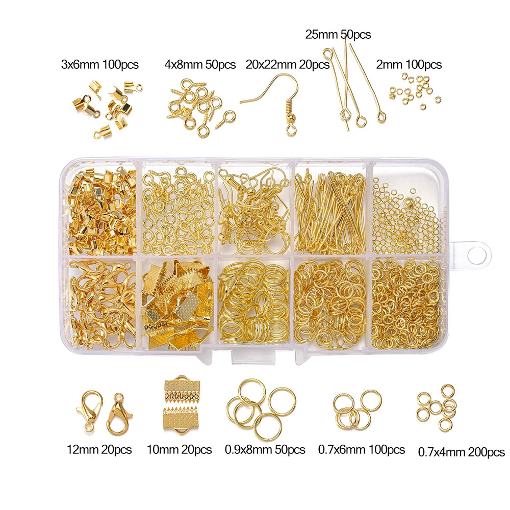 A collection of gold jewelry findings including clasps, hooks, jump rings, and various sizes packaged in compartments.