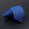A dark blue classic men's tie featuring a repeating plaid dot pattern, shown in a coiled form.