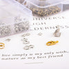 A collection of silver jewelry findings including clasps, hooks, and jump rings displayed on a white surface.