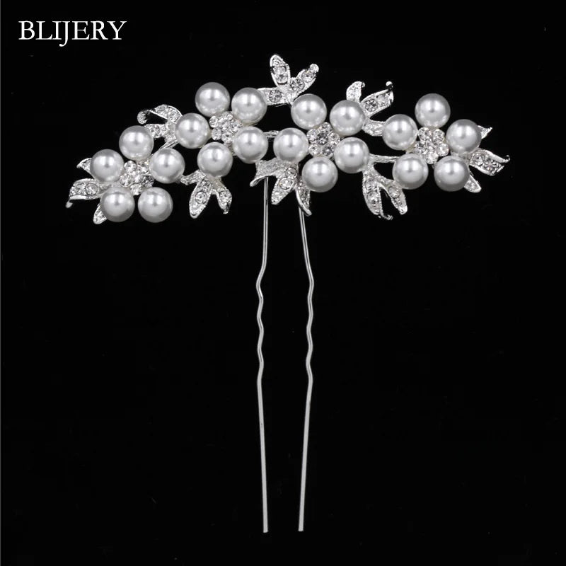 A silver rhinestone bridal hair comb tiara featuring pearl and crystal embellishments.