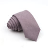 A folded solid purple men's tie made of anti-wrinkle bamboo fiber.