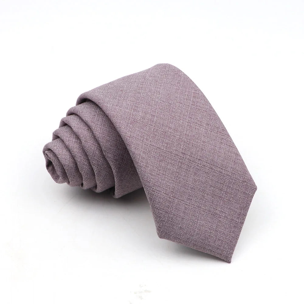A folded solid purple men's tie made of anti-wrinkle bamboo fiber.