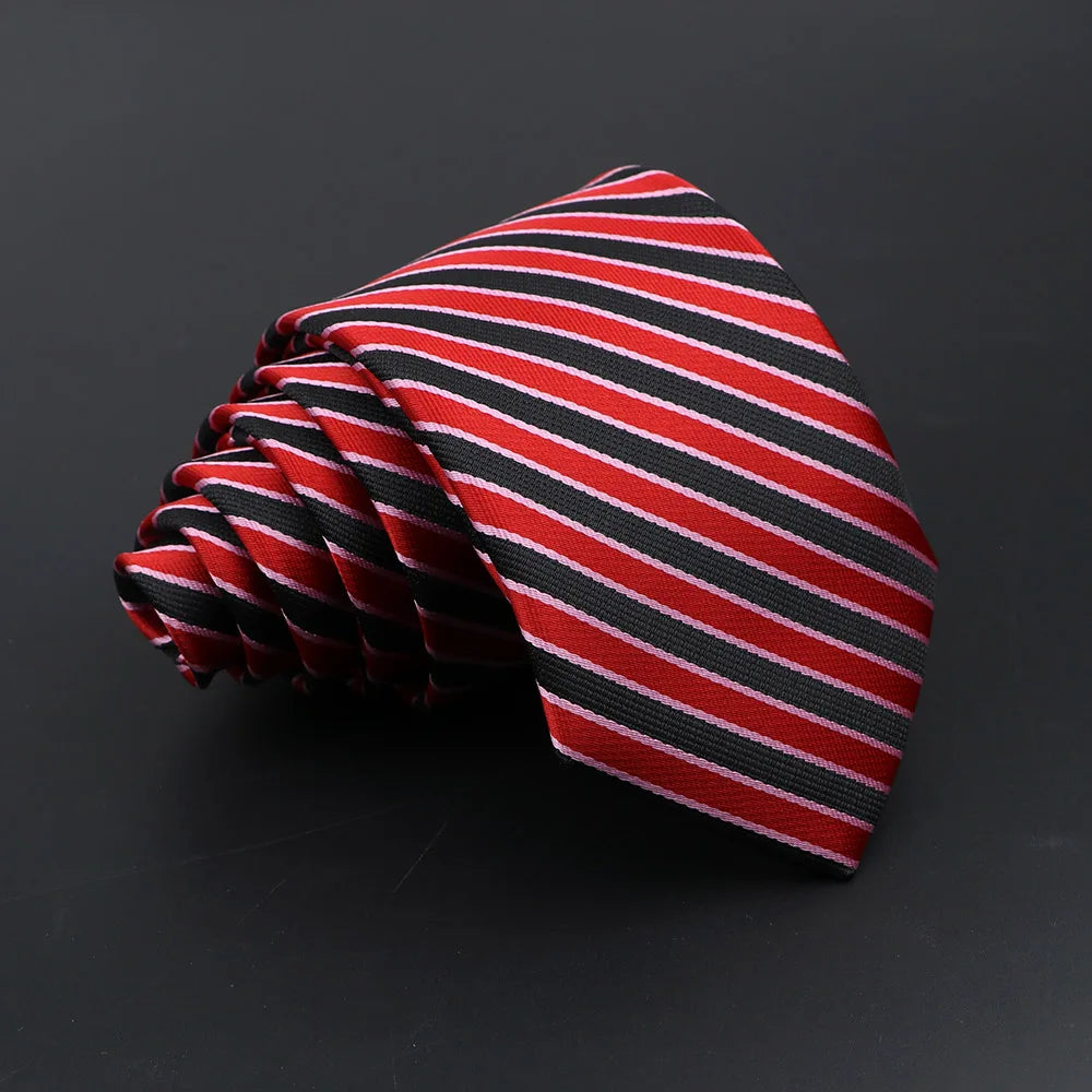 A red and black striped necktie folded into a fan shape.