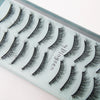 A display of various handmade 3D mink false eyelashes in different styles and lengths.