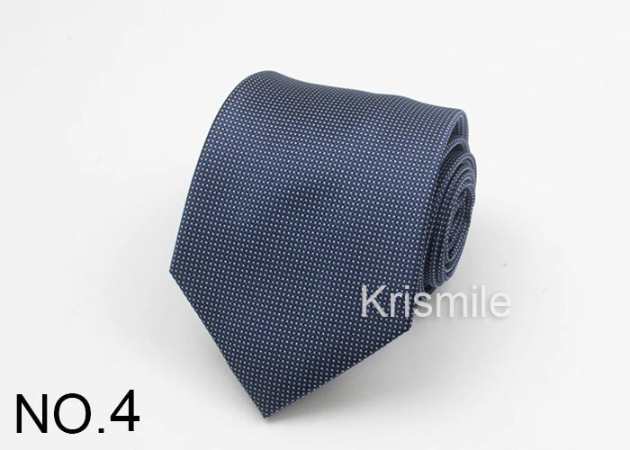 A dark blue necktie with a subtle white dot pattern, folded and displayed on a white background.