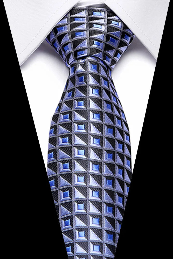 A close-up of a men's silk jacquard tie featuring a geometric pattern in blue and black.