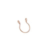 A small gold-toned faux septum nose ring hoop with a zircon accent.