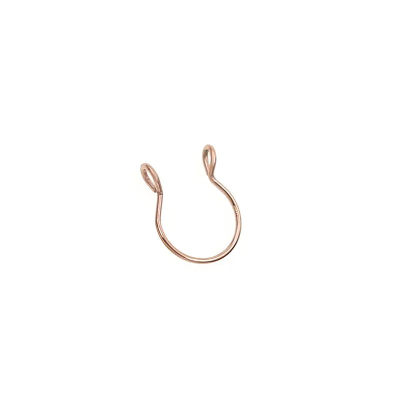 A small gold-toned faux septum nose ring hoop with a zircon accent.