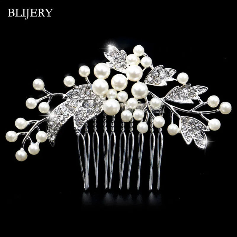 A silver rhinestone bridal hair comb tiara featuring pearl accents and leafy designs.