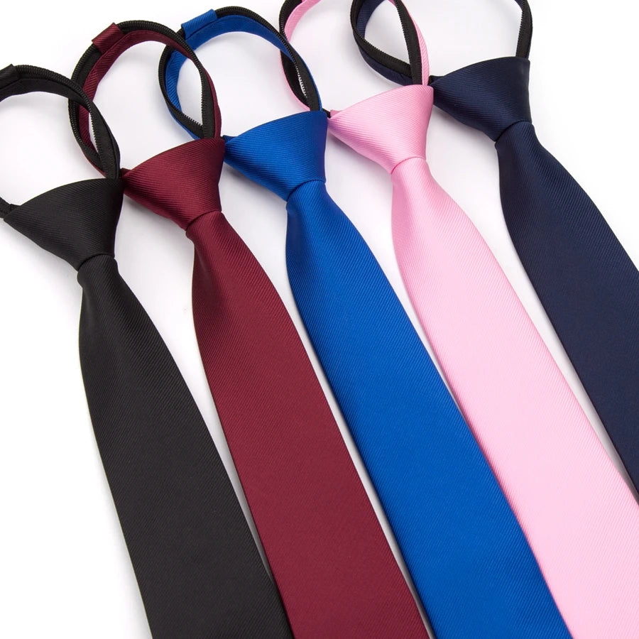 A collection of six satin neckties in various colors including black, maroon, royal blue, pink, and navy.