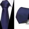 Dark blue striped silk tie shown folded and laid flat against a white background.