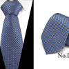 Blue silk jacquard tie with a repeating geometric pattern shown against a white background.