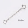 A silver extension chain with a loop and jump rings for jewelry making.