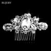 A sparkling silver rhinestone bridal hair comb tiara with a central oval stone and surrounding clear crystals.