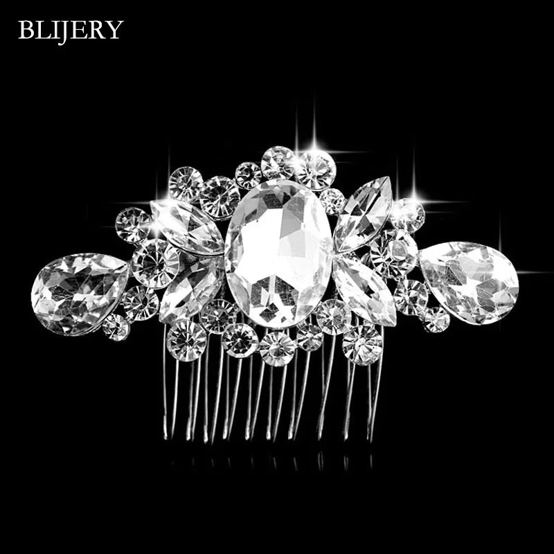A sparkling silver rhinestone bridal hair comb tiara with a central oval stone and surrounding clear crystals.