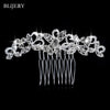 A delicate silver rhinestone bridal hair comb tiara with dangling strands.