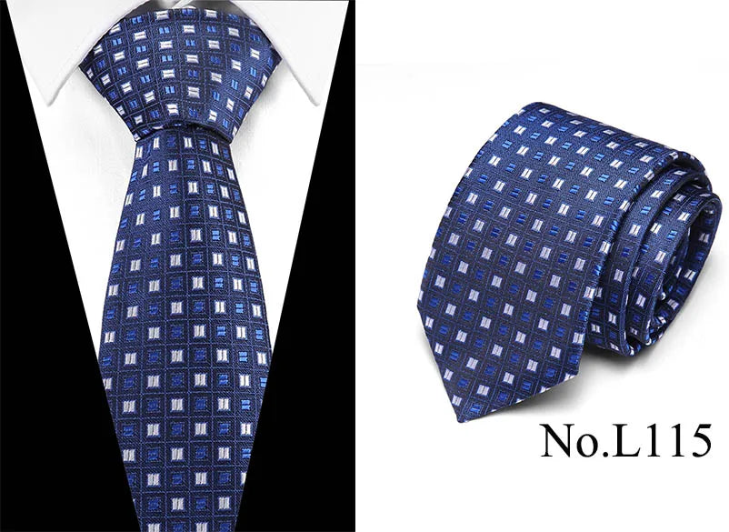 A dark blue silk jacquard tie with a repeating geometric pattern shown against a white background.