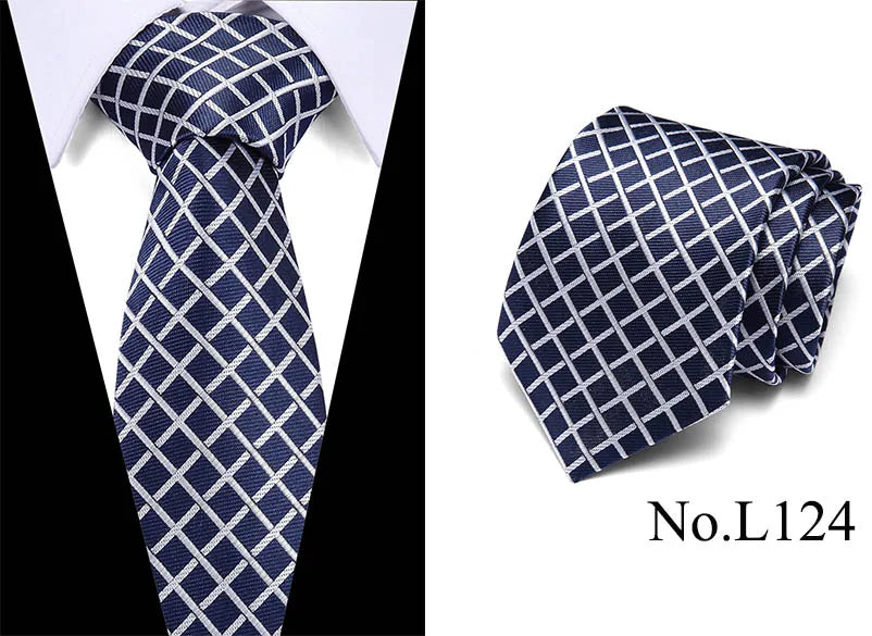 Navy blue silk jacquard tie folded and displayed against a white background.