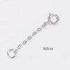 Silver extension chain for jewelry making with a jump ring closure.