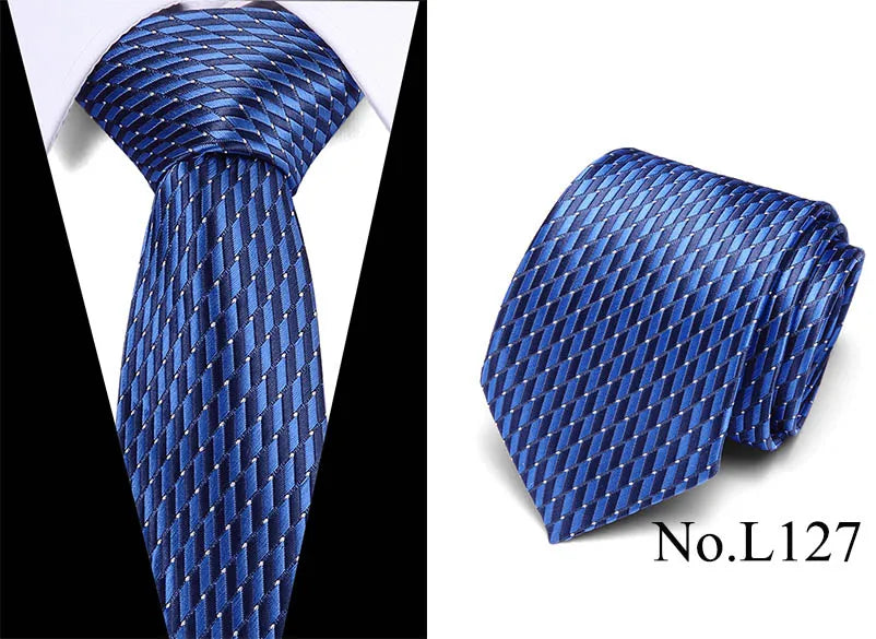 Blue silk jacquard tie with a diagonal pattern shown in a vertical and folded view.