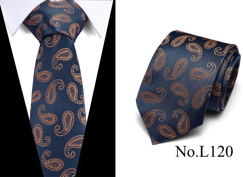 Navy blue silk jacquard tie with gold paisley pattern shown against a white shirt.