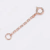 A delicate gold-toned extension chain with a loop for jewelry making.