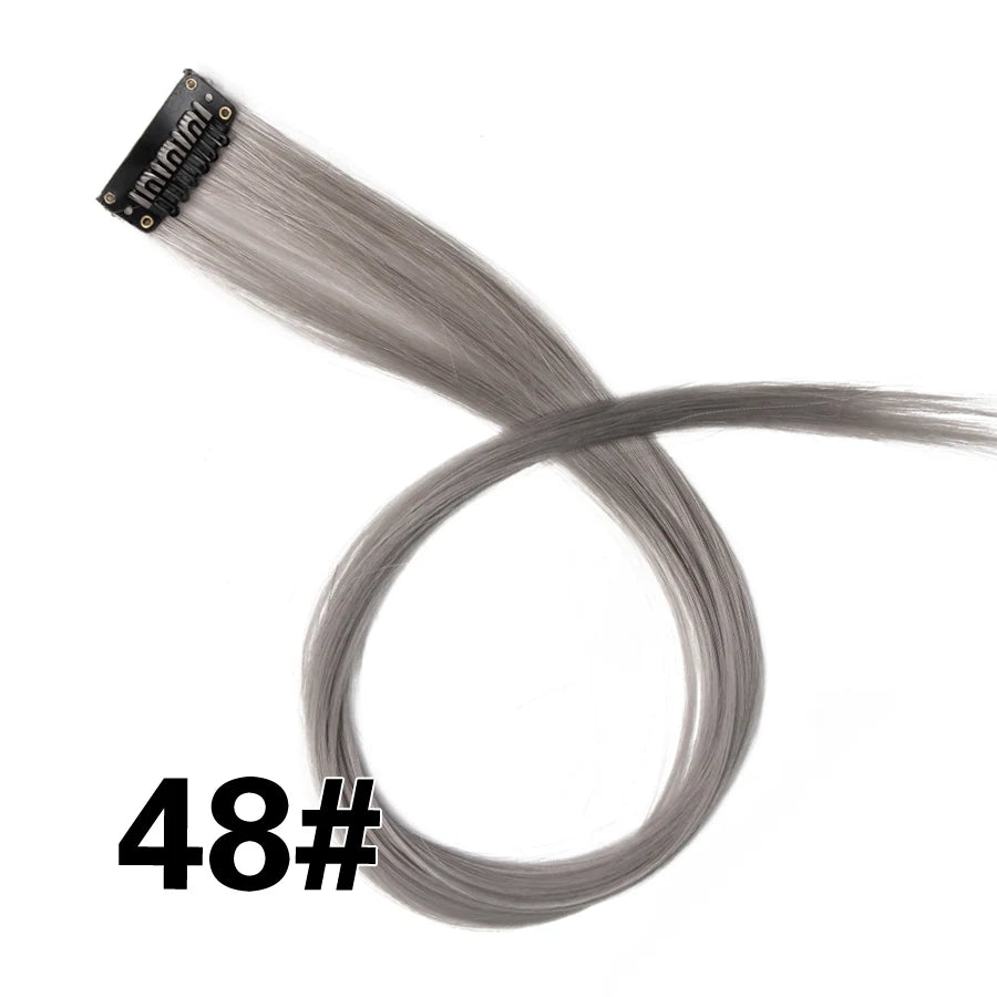 A bundle of gray synthetic hair extensions with a clip-in attachment.